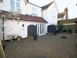 2 bedroom town house within attractive central village mews setting.